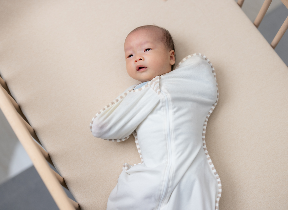 baby in sleep suit
