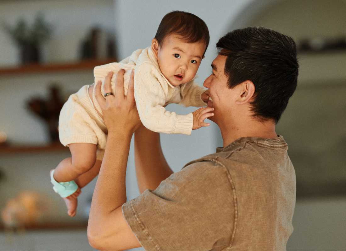 Dad hold baby in the air