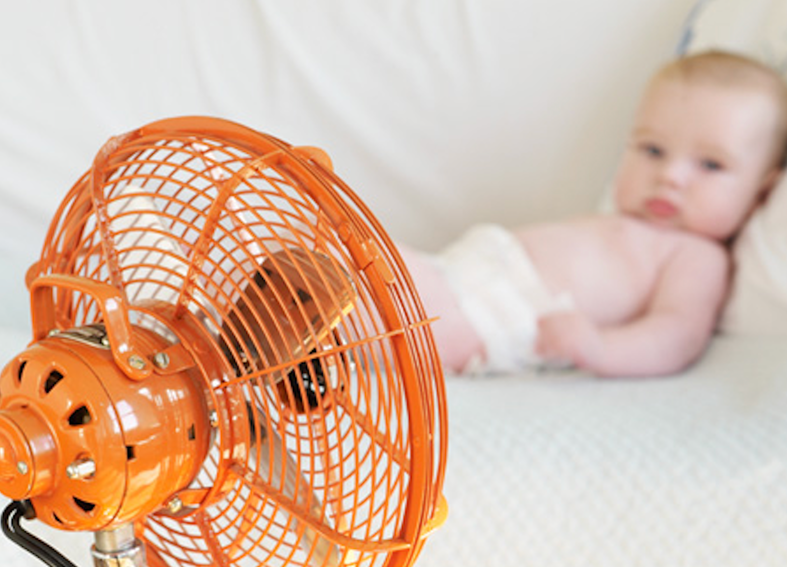 Baby Sleeping  next to fan